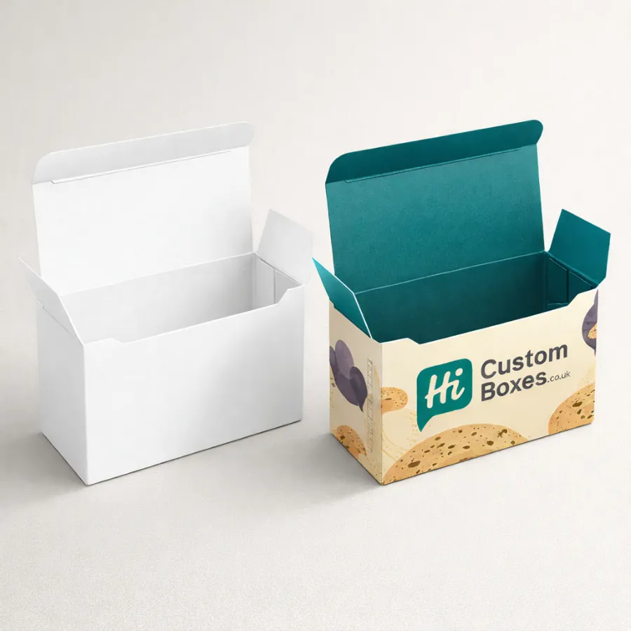 Two open cardboard biscuit boxes- one plain white and one with a teal interior lining- class=